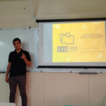 Estudante Cleber Silva durante apresentação do relatório de pesquisa.